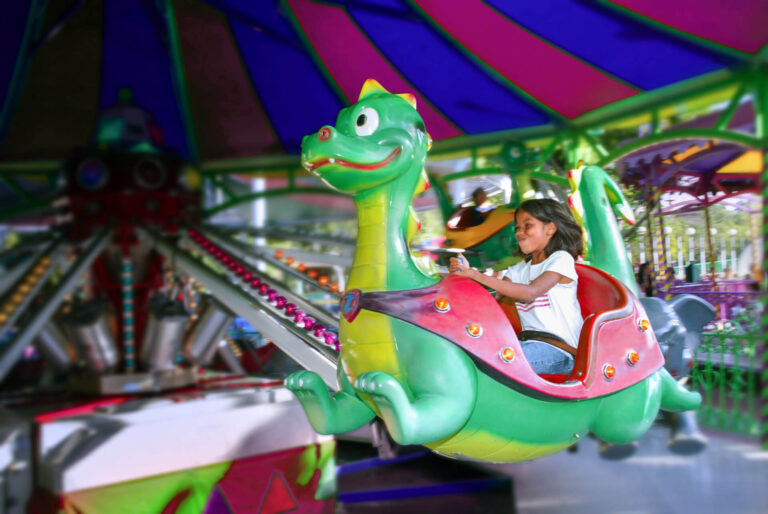 girl on the FLying Animals ride
