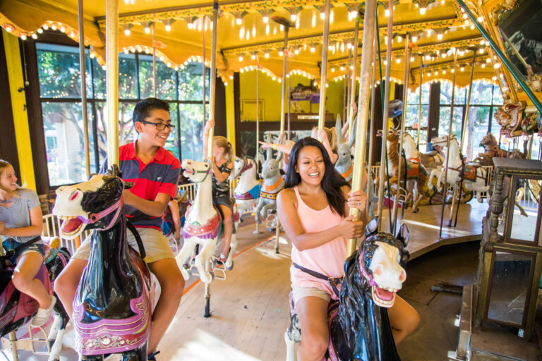Merry Go Round at Castle Park - mother and son on the carousel