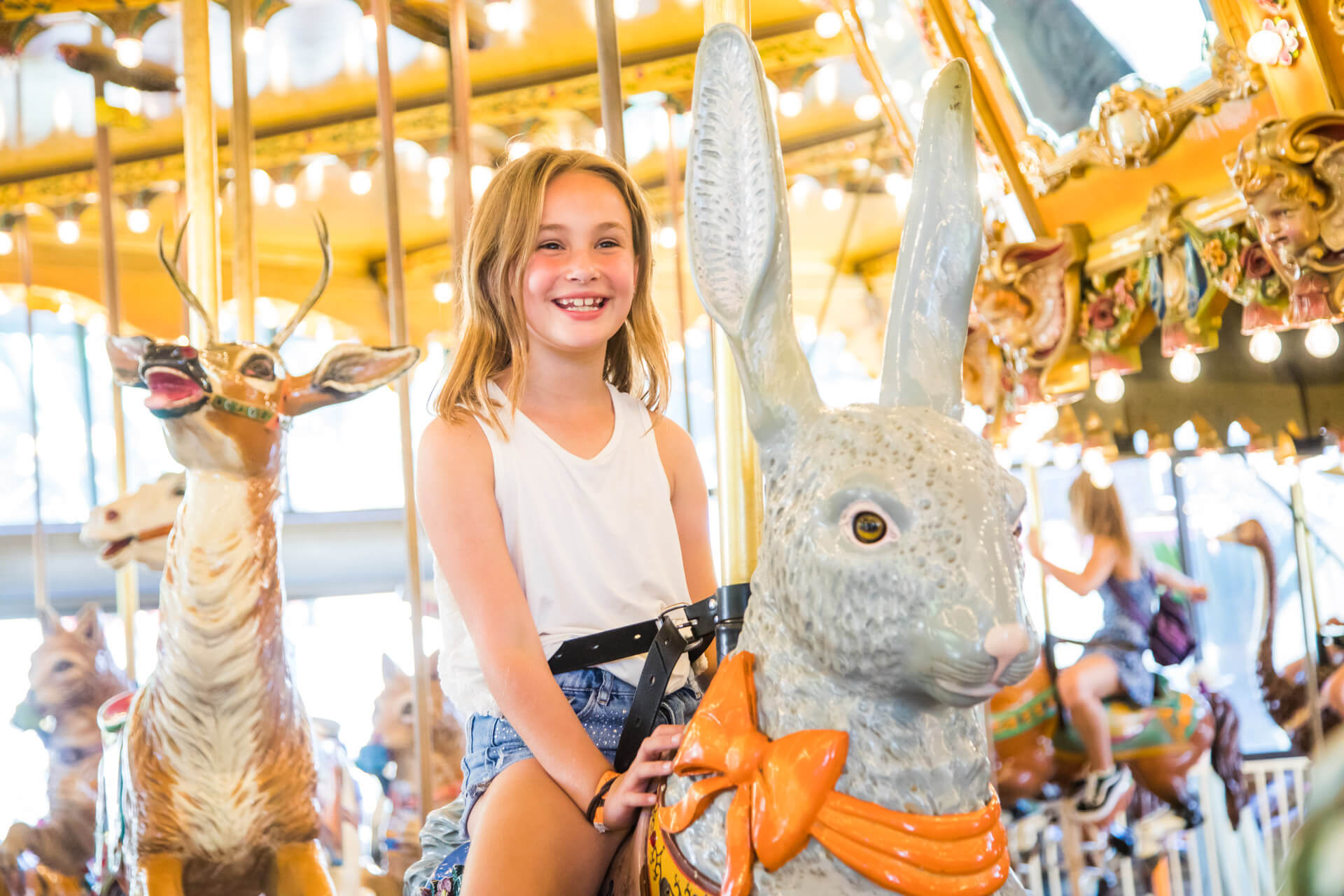 Merry Go Round at Castle Park - Girl riding the carousel