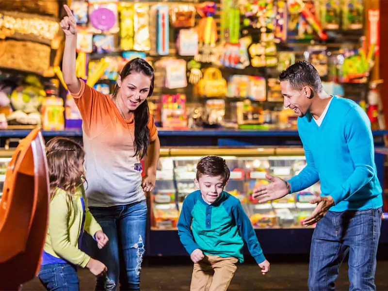 Family playing in the arcade
