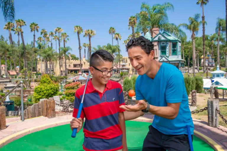 Father and son playing Mini Golf